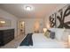 Bright bedroom featuring a bed, neutral decor, and easy access to a bathroom for added convenience at 3403 Keith Dr, Charlotte, NC 28269