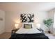 Inviting bedroom with a comfortable bed, decorative pillows, and artwork for a stylish and relaxing atmosphere at 3403 Keith Dr, Charlotte, NC 28269