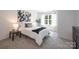 Cozy bedroom featuring a comfortable bed, stylish decor, and a bright window for natural light at 3403 Keith Dr, Charlotte, NC 28269