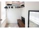 Walk-in closet providing ample storage space with shelves, hanging rods, and a convenient bench at 3403 Keith Dr, Charlotte, NC 28269