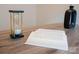 Desk featuring modern hourglass and a book at 3403 Keith Dr, Charlotte, NC 28269