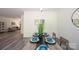 Inviting dining room with gray wood flooring, modern furnishings, and contemporary decor throughout the home at 3403 Keith Dr, Charlotte, NC 28269