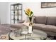 Inviting living room featuring a comfortable couch, stylish decor, and hardwood floors at 3403 Keith Dr, Charlotte, NC 28269