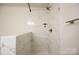 Modern bathroom shower featuring marble tile and sleek hardware for a luxurious showering experience at 3403 Keith Dr, Charlotte, NC 28269