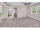 Bright, spacious bedroom with a ceiling fan, neutral walls, and plush carpet at 3826 Yorkford Dr, Charlotte, NC 28269