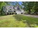 Charming two-story home with manicured lawn, mature trees, and an attached garage at 3826 Yorkford Dr, Charlotte, NC 28269