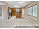 A spacious kitchen with oak cabinets, granite countertops and a central kitchen island at 3826 Yorkford Dr, Charlotte, NC 28269