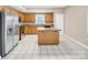 Bright eat-in kitchen featuring stainless steel appliances and tile flooring at 3826 Yorkford Dr, Charlotte, NC 28269