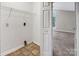 A functional laundry room with shelving and connections, conveniently located in the home at 3826 Yorkford Dr, Charlotte, NC 28269