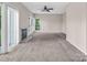 Bright living room featuring large windows and neutral wall colors and plush carpet at 3826 Yorkford Dr, Charlotte, NC 28269