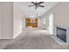 Spacious living room with a fireplace, tile flooring, and access to a bright kitchen at 3826 Yorkford Dr, Charlotte, NC 28269