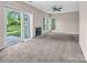 Living room with sliding glass door to backyard, a fireplace, and natural light at 3826 Yorkford Dr, Charlotte, NC 28269