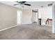 Spacious loft area with a ceiling fan and a staircase at 3826 Yorkford Dr, Charlotte, NC 28269