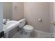 The updated powder room features a modern sink and fixtures at 3826 Yorkford Dr, Charlotte, NC 28269