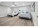 Bright bedroom featuring two twin beds with hardwood floors and a ceiling fan at 4049 Shadowbrook Rd, Waxhaw, NC 28173