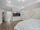 This is a spacious bedroom with a tray ceiling, walk-in closet and mountain view TV at 4049 Shadowbrook Rd, Waxhaw, NC 28173