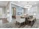 Elegant dining room with a fireplace, stylish lighting and sleek, modern design at 4049 Shadowbrook Rd, Waxhaw, NC 28173