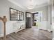Inviting foyer with wood floors, decorative console table and a view of the front yard at 4049 Shadowbrook Rd, Waxhaw, NC 28173
