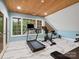 Spacious home gym with large windows, high ceilings, and exercise equipment at 4049 Shadowbrook Rd, Waxhaw, NC 28173