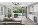 The great room features a large opening to the screened-in outdoor living area and pool at 4049 Shadowbrook Rd, Waxhaw, NC 28173