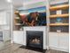 Cozy living room with a modern fireplace, built-in shelving, and inviting decor at 4049 Shadowbrook Rd, Waxhaw, NC 28173
