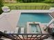 Gorgeous backyard oasis with a large swimming pool, spa, and lounging area perfect for relaxation at 4049 Shadowbrook Rd, Waxhaw, NC 28173