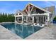 An inviting in-ground pool with ample patio space, perfect for outdoor entertaining at 4049 Shadowbrook Rd, Waxhaw, NC 28173