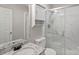 Modern bathroom boasts a marble-tiled shower, granite vanity, and a built-in storage cabinet at 409 W 8Th St, Charlotte, NC 28202