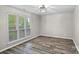 Bright bedroom featuring stylish flooring, neutral paint, and a window providing ample natural light at 409 W 8Th St, Charlotte, NC 28202