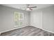 Inviting bedroom with natural light, ceiling fan, and a closet, offering a relaxing and comfortable retreat at 409 W 8Th St, Charlotte, NC 28202