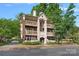 Charming multi-story building with inviting balconies and manicured landscaping at 409 W 8Th St, Charlotte, NC 28202