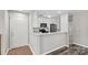 Modern kitchen with white cabinets, granite countertops, and stainless steel appliances, perfect for cooking at 409 W 8Th St, Charlotte, NC 28202