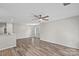 Bright living room featuring modern ceiling fan, and wood flooring offering a stylish and comfortable living space at 409 W 8Th St, Charlotte, NC 28202