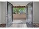 View from the open french doors onto a concrete patio in this condo for rent at 409 W 8Th St, Charlotte, NC 28202