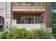 Charming ground floor patio with brick and stucco accents and lush green foliage at 409 W 8Th St, Charlotte, NC 28202