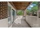 Covered patio with brick accents offering an outdoor seating area at 409 W 8Th St, Charlotte, NC 28202