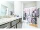 Charming bathroom featuring a granite vanity and a decorative shower curtain with a stylish Eiffel Tower theme at 424 Cassia Ct, Fort Mill, SC 29708