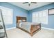 Bright bedroom with blue walls, plantation shutters, neutral carpet, and ceiling fan at 424 Cassia Ct, Fort Mill, SC 29708