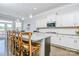 Gourmet kitchen with granite countertops, white cabinets, and stainless steel appliances at 424 Cassia Ct, Fort Mill, SC 29708
