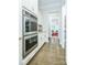 Stainless steel double ovens and white cabinets in a modern kitchen at 424 Cassia Ct, Fort Mill, SC 29708