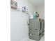 Convenient laundry room with modern washer and dryer units, plus wire shelving for storage at 424 Cassia Ct, Fort Mill, SC 29708