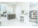 Main bathroom with vanity, make up table and shoe closet at 424 Cassia Ct, Fort Mill, SC 29708