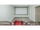 Home theater with a large screen, comfortable seating, and rustic sliding barn door at 424 Cassia Ct, Fort Mill, SC 29708