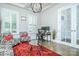Home office featuring plantation shutters, coffered ceiling, and glass French doors at 424 Cassia Ct, Fort Mill, SC 29708