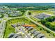 Community aerial view showcasing mature landscaping, tennis courts, pool, and surrounding neighborhood at 4511 Middlebury Ln, Fort Mill, SC 29715