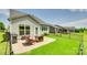 Backyard featuring a paver patio with outdoor furniture and a grill, grass, and a fenced perimeter at 4511 Middlebury Ln, Fort Mill, SC 29715