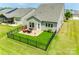 Aerial view of backyard featuring a fenced yard and paver patio with outdoor furniture and a grill at 4511 Middlebury Ln, Fort Mill, SC 29715