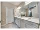 Bright bathroom with a double sink vanity, large mirror, and neutral color palette at 4511 Middlebury Ln, Fort Mill, SC 29715