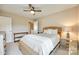 Comfortable bedroom features a textured bed frame, side table, and neutral decor at 4511 Middlebury Ln, Fort Mill, SC 29715