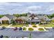 Community clubhouse featuring craftsman-style architecture, lush landscaping, and convenient parking at 4511 Middlebury Ln, Fort Mill, SC 29715